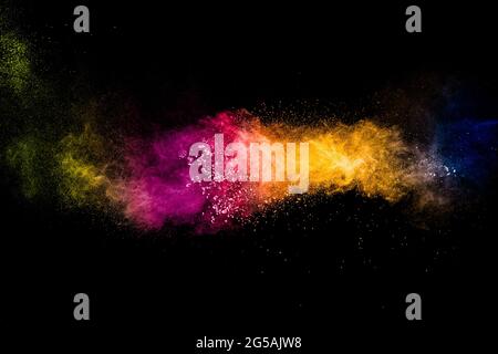 Multicolored powder explosion on black background.Colorful of pastel powder explosion. Stock Photo