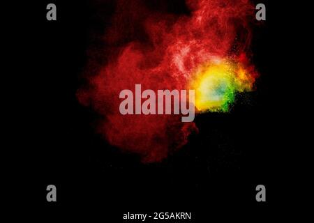 Multicolored powder explosion on black background.Colorful of pastel powder explosion. Stock Photo