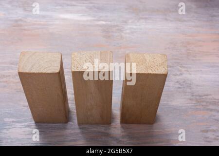 Closeup shot of three wooden rectangular blocks Stock Photo