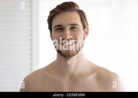 Portrait of happy attractive bearded well built man with stubble Stock Photo