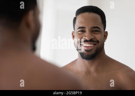 Portrait of handsome young African American man with stylish stubble Stock Photo