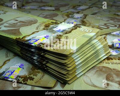 Money of Canada. Canadian dollar bills. CAD banknotes. 100 dollars. Business, finance, news background. Stock Photo