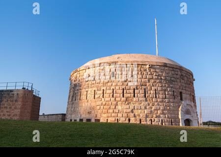 Round tower of the Fort Tigne. It is a polygonal fort in Tigne Point, Sliema, Malta. It was built by the Order of Saint John between 1793 and 1795 Stock Photo