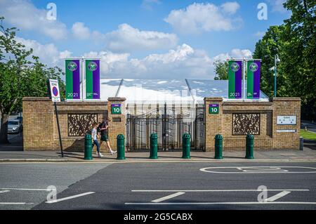 London, UK. 26th June, 2021. A roll of honour above  the  gates of the All England Lawn and Tennis club honoring 2019 Wimbledon Gentlemen's and Ladies singles champions Novak Djokovic  and Simona Halep as it prepares to host the 2021 Wimbledon Championships which start on Monday 28 June. Last year's grand slam tournament was cancelled for the first time since world war 2 due to the coronavirus pandemic. The tournament will take place from 28 June to 11 July. Credit: amer ghazzal/Alamy Live News Stock Photo