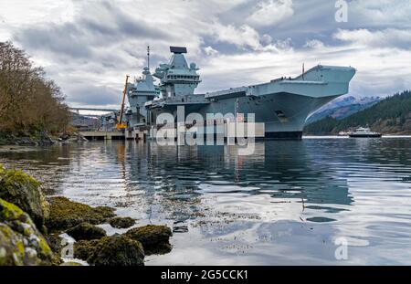 The aircraft carrier HMS Queen Elizabeth berthed on the side of Loch Long at Glenmallon, Argyll and Bute, Scotland, UK Stock Photo