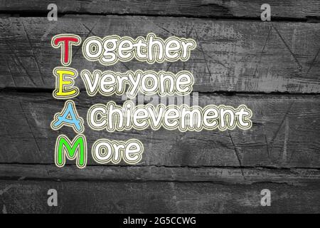 team meaning written on blackboard background, high Stock Photo