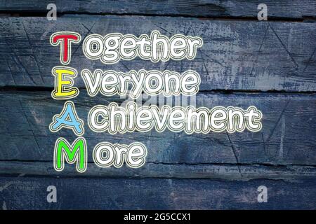 team meaning written on blackboard background, high Stock Photo