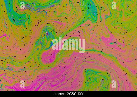 Fluid soap bubble psychedelic colorful abstract art. Surreal patterns with rainbows and waves of color in motion. Stock Photo
