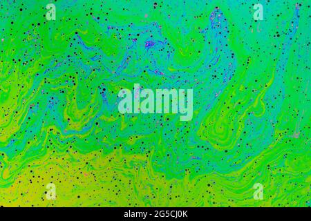 Fluid soap bubble psychedelic colorful abstract art. Surreal patterns with rainbows and waves of color in motion. Stock Photo