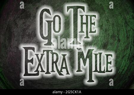 Go The Extra Mile Concept text Stock Photo