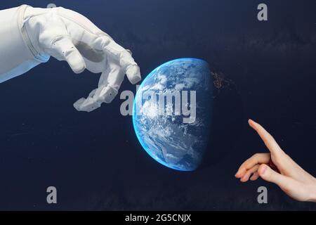 close up the hand of human and the astronaut touch in the outer space, elements of this image furnished by nasa Stock Photo