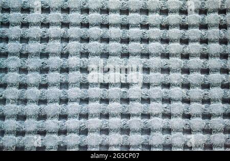 Close-up of a checkered fabric in a blue-and-white check. Abstract background. Stock Photo