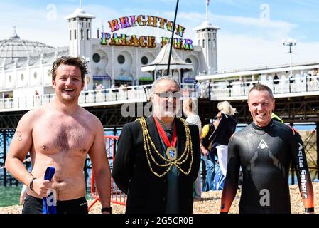 Brighton, UK. June 26th 2021 1st and 2nd finishers respectively  of Swimming Club Pier to Pier Swim: Nigel Carrian [R] and Tom Atwell [L] with Mayor of Brighton & Hove Cllr. Alan Robins. photo ©Julia Claxton Credit: Julia Claxton/Alamy Live News Stock Photo