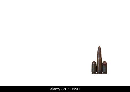 Three different caliber bullets together isolated on a white background. Bullets isolated on a white background. Military concept. Stock Photo