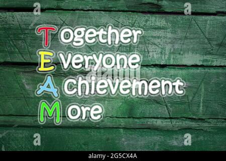 team meaning written on blackboard background, high Stock Photo