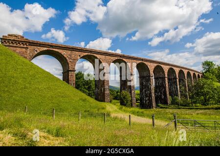 A sadly disused arched railway viaduct (Lowgill Viaduct) at Firbank near Sedbergh in Cumbria North West England Stock Photo