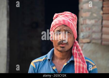Portrait of a Rural Man Standing in Front Stock Photo
