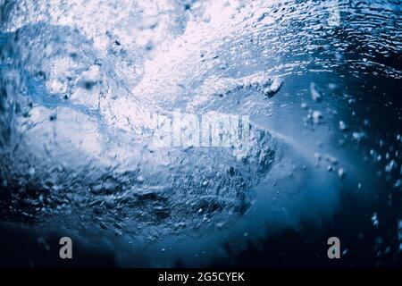Ocean wave underwater with transparent water and bubbles. Stock Photo