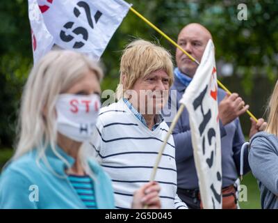 LICHFIELD. UK.  26th JUNE 2021.  HS2 Rebellion Stop HS2 rally in Beacon Park, Lichfield, marks the beginning of an 8 day walk to Wigan to raise awareness of the Stop HS2 campaign. Conservative MP Michael Fabricant (centre) speaks in support of the protestors efforts .  Credit: Richard Grange / Alamy Live News Stock Photo