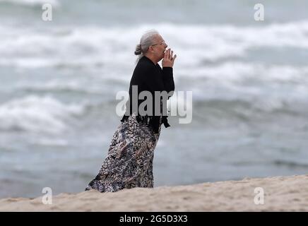 Surfside, USA. 25th June, 2021. A woman reacts near the Champlain Towers South Condo in Surfside, Florida, Friday, June 25, 2021. (Photo by David Santiago/Miami Herald/TNS/Sipa USA) Credit: Sipa USA/Alamy Live News Stock Photo