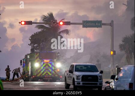 Surfside, USA. 31st Dec, 2000. Miami-Dade County Fire Rescue crews battles a fire early Friday morning as they work on the piles of rubble of the Champlain Towers South Condo, located at 8777 Collins Avenue in Surfside, that collapsed Thursday morning, on Friday, June 25, 2021. (Photo by Pedro Portal/Miami Herald/TNS/Sipa USA) Credit: Sipa USA/Alamy Live News Stock Photo