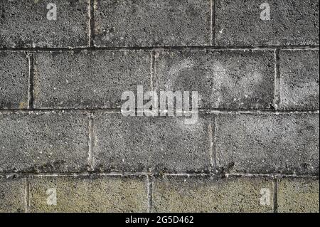Beautiful closeup view of grey concrete block wall near Ballawley Park, Sandyford, Dublin, Ireland. High resolution construction background. Concrete Stock Photo