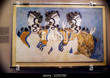 Minoan Ladies in Blue fresco recreated from the Palace of Knossos on Crete and represents the first advanced civilization in Europe, Greece. Stock Photo