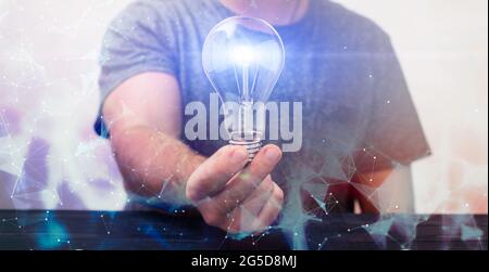 Creative new idea. Innovation, brainstorming, inspiration and solution concepts. Man holding light bulb, Stock Photo