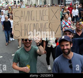 London,  UK. 26th June, 2021. Tens of thousands of anti-lockdown and anti-vaccine protesters took the streets of central London as UK Health Secretary Matt Hancock found out to be breaching his government's own lockdown rules during an affair with his closest aide at his department. Credit: Tayfun Salci/ZUMA Wire/Alamy Live News Stock Photo