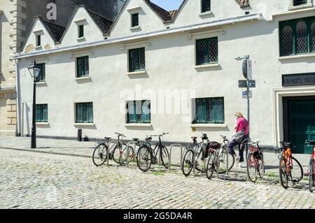 Bicycles in a cobbled square, Bristol city centre, UK Stock Photo