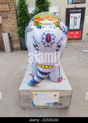 Maidstone, Kent, UK. 26th June, 2021. Elmer's Big Heart of Kent Parade aims to raise awareness of Heart of Kent Hospice through an innovative and Maidstone's first ever sculpture trail featuring 51 artistically decorated Elmer elephants dotted around the town. Pictured: an Elmer at the entrance to Fremlin Walk. Credit: James Bell/Alamy Live News Stock Photo