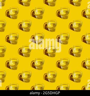 Seamless pattern of glasses with water on a yellow background. For printing posters on fabric. Stock Photo