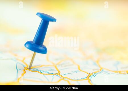 Vacation and travel concept, blue push pin on the map, destination, selective focus Stock Photo