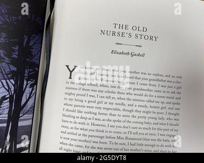 Opening text of The Old Nurse's Story by Elizabeth Gaskell in a book with a collection of ghost stories Stock Photo