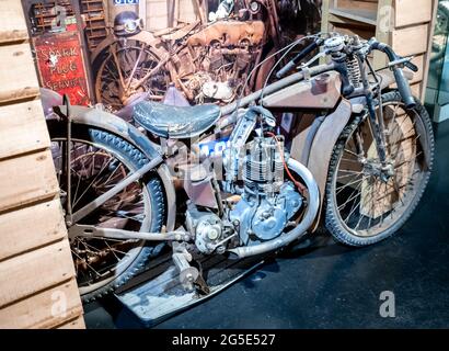 Yeovil, Somerset, UK – June 18 2021. Rusty vintage speedway motorcycle being repaired and restored Stock Photo