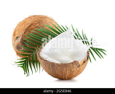 coconut with leaf and half of coconut with milk isolated on a white background. Stock Photo