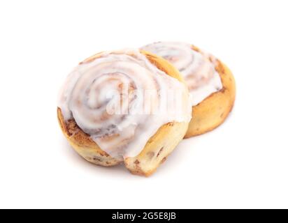 Two Frosted Cinnamon Rolls on a White Background Stock Photo