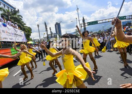 San Salvador, El Salvador. 26th June, 2021. Transgender cheerleaders perform during the Pride March.Members of the LGBT community took to the streets to perform in an annual Pride Parade celebrating diversity and protest for human rights laws to be approved by Congress. (Photo by Camilo Freedman/SOPA Images/Sipa USA) Credit: Sipa USA/Alamy Live News Stock Photo