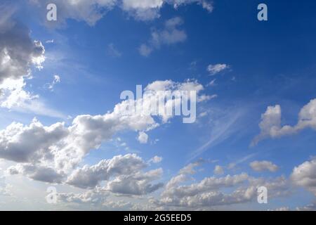 Altocumulus floccus clouds . Mid altitude clouds during the summer Stock Photo