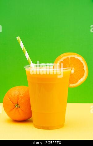 Freshly Squeezed Orange Juice in a Plastic Disposable Cup Stock Photo