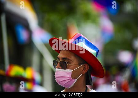 San Salvador, El Salvador. 26th June, 2021. A demonstrator looks on while marching.Members of the LGBT community march to celebrate pride day months after the Salvadoran Congress archived various law's that would benefit the LGBT community. Credit: Camilo Freedman/ZUMA Wire/Alamy Live News Stock Photo