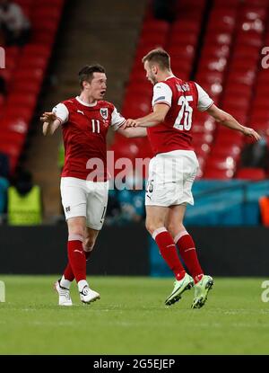 London, Britain. 26th June, 2021. Austria's Sasa Kalajdzic (R) celebrates with Michael Gregoritsch during the Round of 16 football match between Italy and Austria at the UEFA EURO 2020 Championship in London, Britain, on June 26, 2021. Credit: Han Yan/Xinhua/Alamy Live News Stock Photo