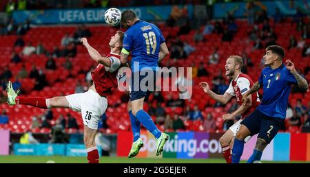 London, Britain. 26th June, 2021. Austria's Sasa Kalajdzic (1st L) vies with Italy's Leonardo Bonucci (2nd L) during the Round of 16 football match between Italy and Austria at the UEFA EURO 2020 Championship in London, Britain, on June 26, 2021. Credit: Han Yan/Xinhua/Alamy Live News Stock Photo