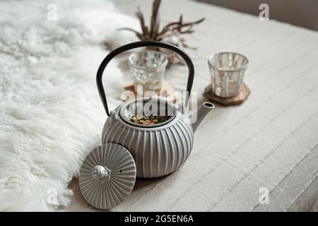Close-up of a teapot in a Scandinavian style with tea. Stock Photo
