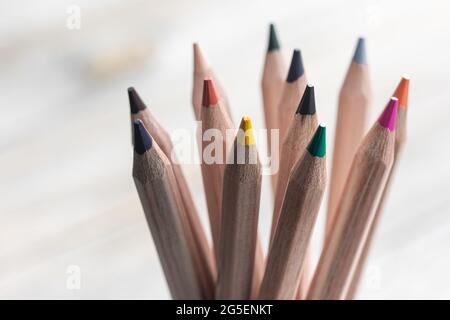 Close up of colored pencils for drawing on blurred background Stock Photo