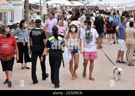 Two agents of the Local Police of El Vendrell patrol through Vendrell to control the capacity and if it is necessary to order people to put on protective face masks against Covid-19.Today the Decree law that eliminates the obligation to wear a face mask for protection against SARS-CoV-2 Covid -19 on the street has come into force in Spain. There are a series of restrictions as long as a distance of at least one and a half meters with non-cohabitants is maintained. When entering public places such as stores, pharmacies, banks, you must put on a facial mask. (Photo by Ramon Costa/SOPA Images/S Stock Photo