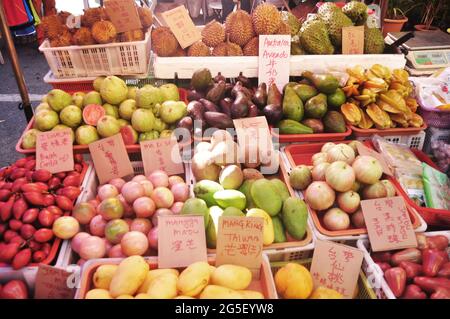 Malays vendor sale fruits vegetables for malaysian people and foreign travelers select buy eat in local shop at Filipino Market Kota Kinabalu bazaar a Stock Photo