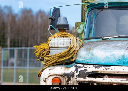 Gulbene, Latvia - May 02, 2021: vintage Soviet truck ZIL 130 in the village, close-up front details Stock Photo