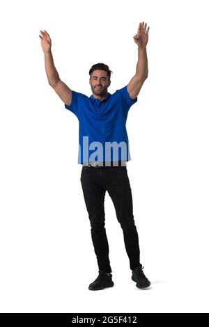 Full length casual portrait of handsome tall young man standing with arms raised isolated on white background Stock Photo