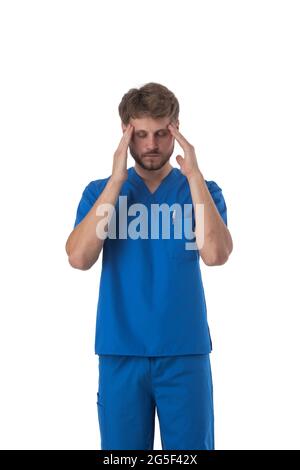 Male healthcare worker nurse surgeon doctor man over isolated background suffering from headache desperate and stressed, hands on head Stock Photo